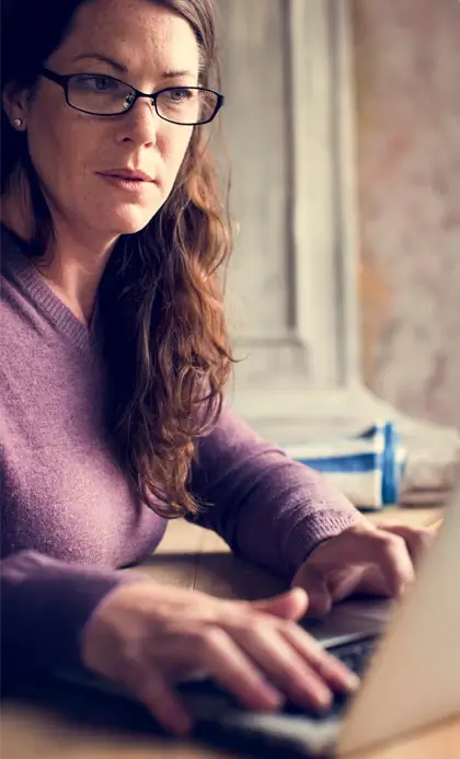 woman looking at laptop screen