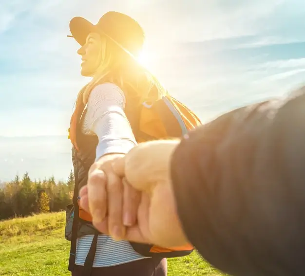 photo of woman outside holding a hand