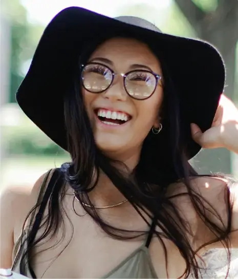 woman with hat smiling