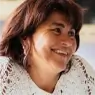 photo of woman looking to the right and smiling