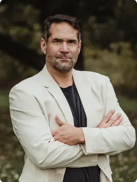 Brian folding arms looking at camera